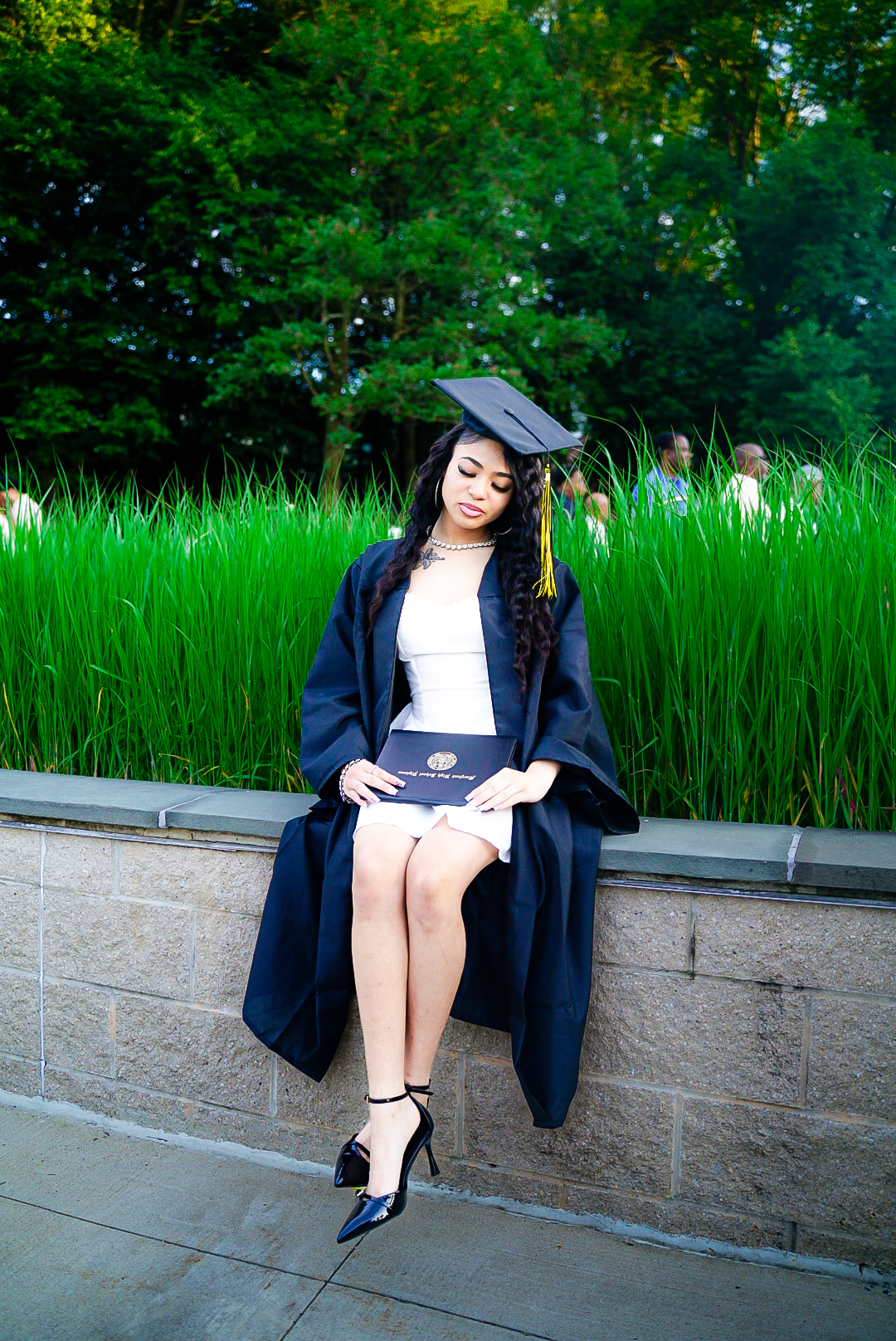 Graduation portrait in tall grass