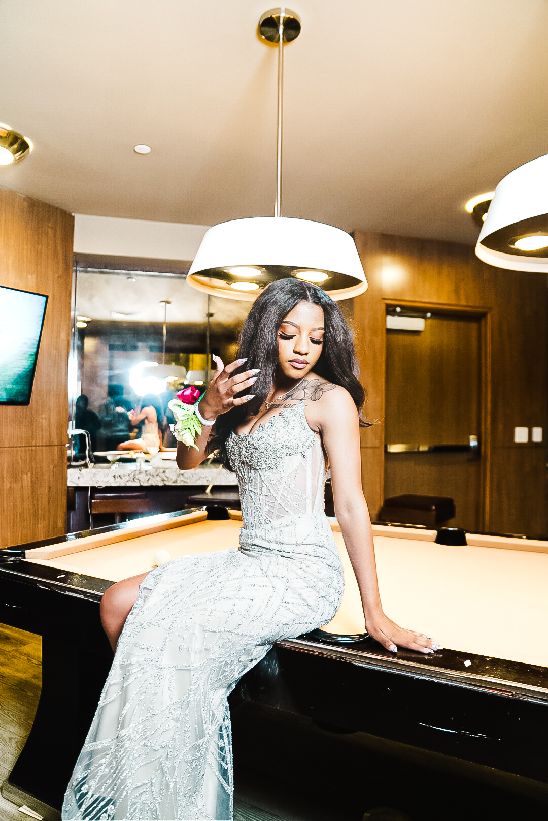 Silver beaded gown at billiards lounge